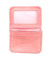 The Bed Stu Jeor is a small pink compact wallet, open to reveal card slots and a transparent ID window—making it a stylish, versatile accessory for everyday use.