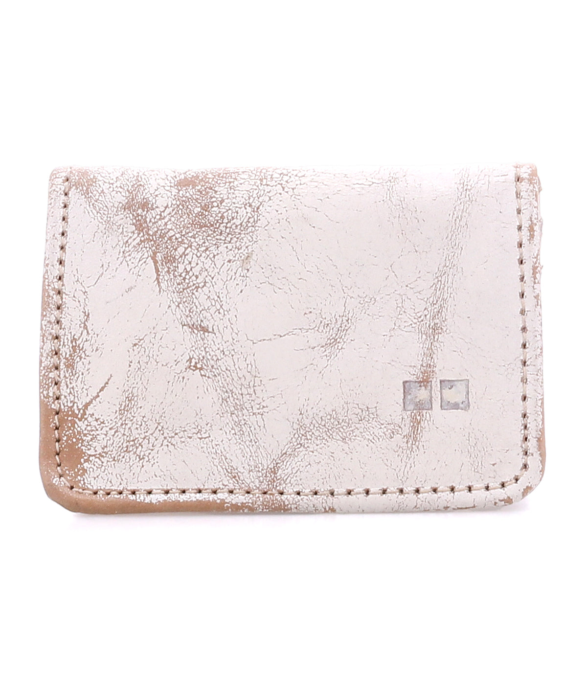 The Bed Stu Jeor is a rustic, light-colored leather card wallet with visible creases, two metallic square accents on the front, and multiple slots for everyday credit card storage.