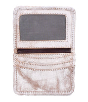 The Bed Stu Jeor is a metallic gold compact wallet featuring a transparent ID window, two credit card slots, and textured stitching, displayed against a white background.