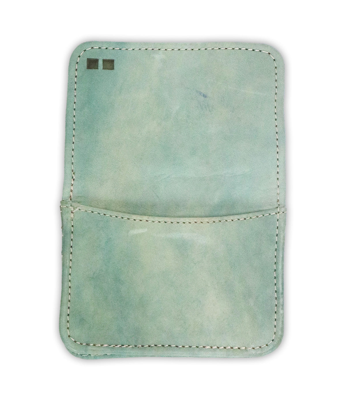 The Bed Stu Jeor is a light blue rustic leather card holder with visible stitching, an open pocket, and two small rectangular marks in the top left corner.
