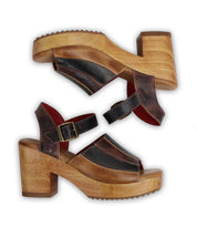 A pair of Bed Stu Jetsetter sandals with leather heels on a white background.