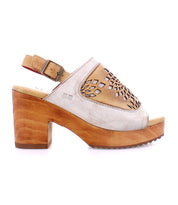 An adjustable ankle buckle sandal with a wooden platform and a wooden heel called Jinkie by Bed Stu.