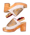 A pair of Jinkie wooden sandals with an adjustable ankle buckle by Bed Stu.