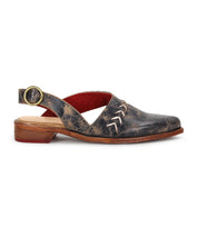 The Bed Stu Join is a single black distressed leather slingback shoe featuring a low wooden heel, side buckle, decorative upper stitching, and a pointed toe.