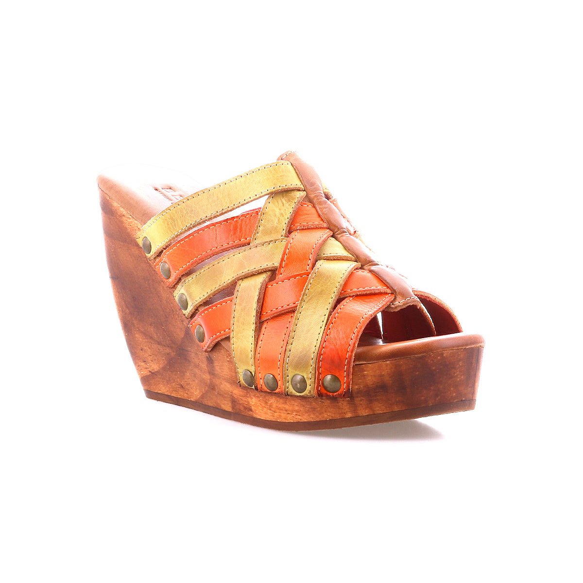 The Bed Stu Josie II is a wooden wedge sandal featuring hand-woven orange and yellow leather straps with metal studs, shown on a white background.