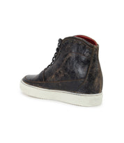 The Joyce II high-top sneaker from Bed Stu features a distressed black leather upper with a lace-up front, providing stylish comfort. Its design is completed by a white rubber sole, beautifully captured in a back-view photograph.
