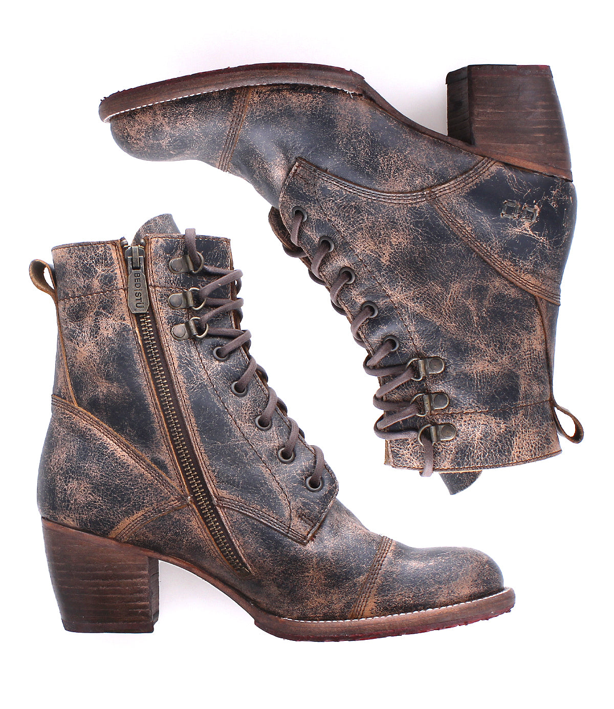 A pair of Bed Stu Judgement distressed brown leather boots with 8-eye lace-up fronts, side zippers, and stacked heels is displayed on a white background.