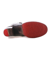 Bottom view of a black Judgement boot dress shoe by Bed Stu, featuring a red sole with embossed patterns, 8-eye lace-up design, and the brand name "Bed Stu".