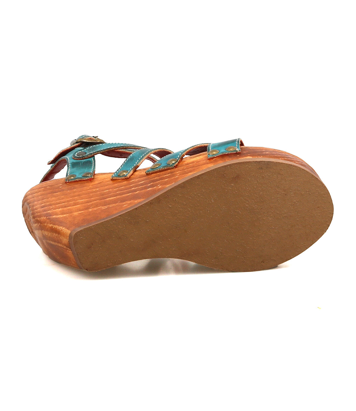 Bed Stu Juliana II is a wooden platform sandal featuring a tan rubber sole and teal leather strappy upper, shown here from the bottom.