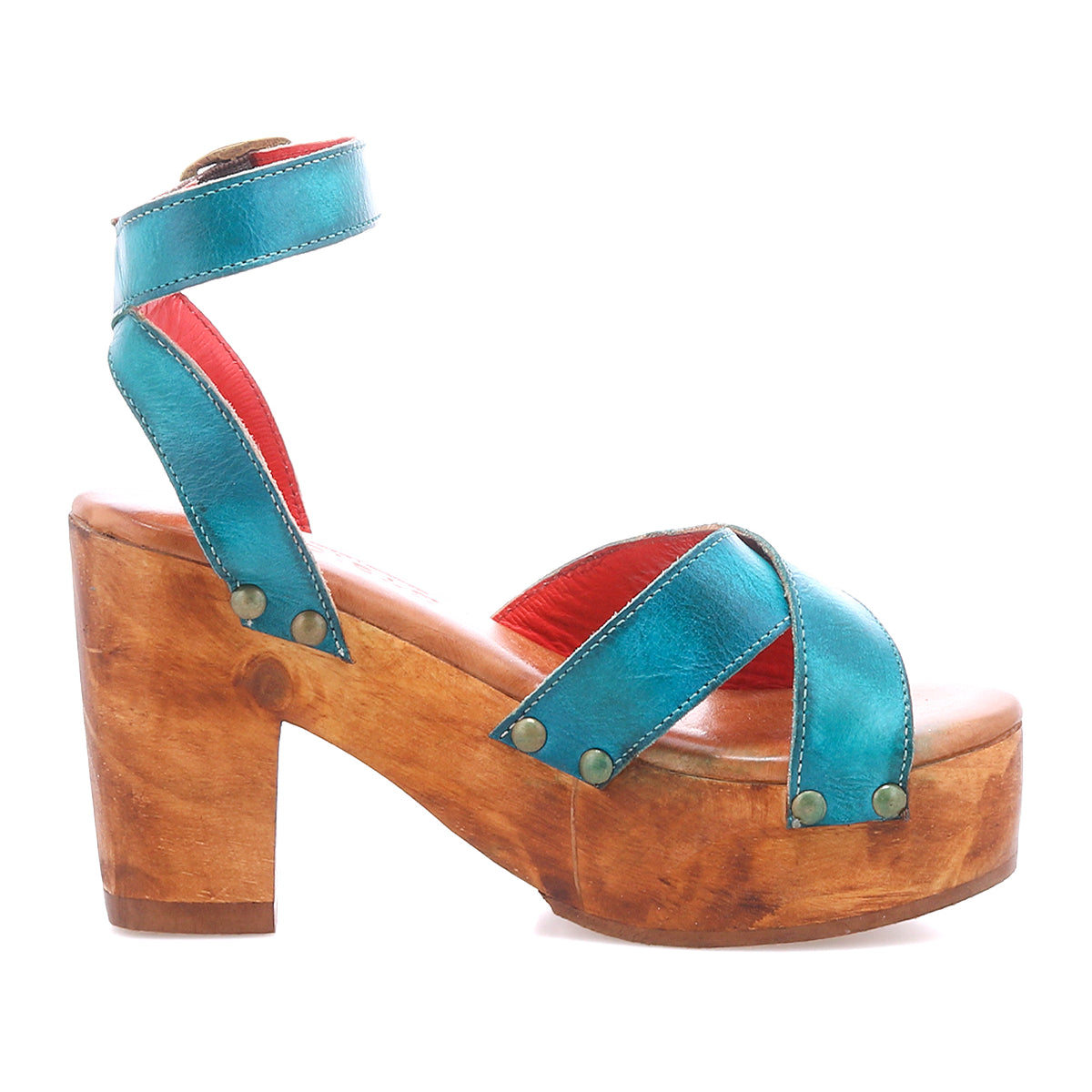 The Bed Stu Kalah is a women's platform sandal featuring sustainably sourced wooden heels, teal leather crisscross straps, and an adjustable ankle strap with buckle.