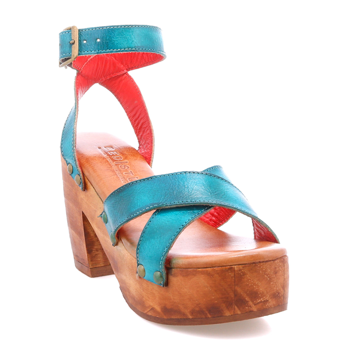 The Kalah sandal by Bed Stu features a teal and red design, sustainably sourced wooden platform heel, open toe, adjustable ankle strap, and buckle closure.