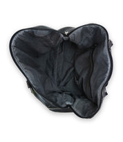 Top view of an open, empty leather travel duffle bag, crafted from vegetable tanned leather, featuring a zippered pocket on the inner side. The Keg by Bed Stu.