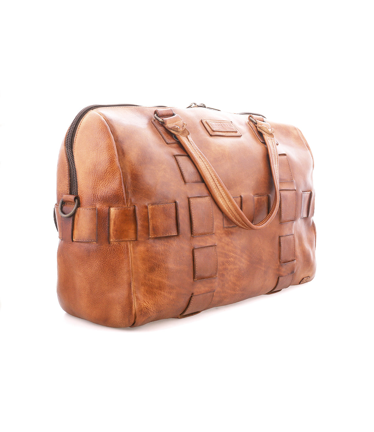 The Bed Stu Keg is a brown leather duffle bag with handles, zipper closure, woven square pattern sides, vegetable tanned leather, and a luggage sleeve, shown on a white background.