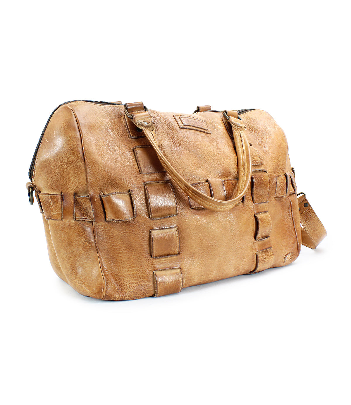 A handcrafted tan leather travel duffle bag with square patch detailing, featuring a short handle and an adjustable shoulder strap from Bed Stu, called Keg.