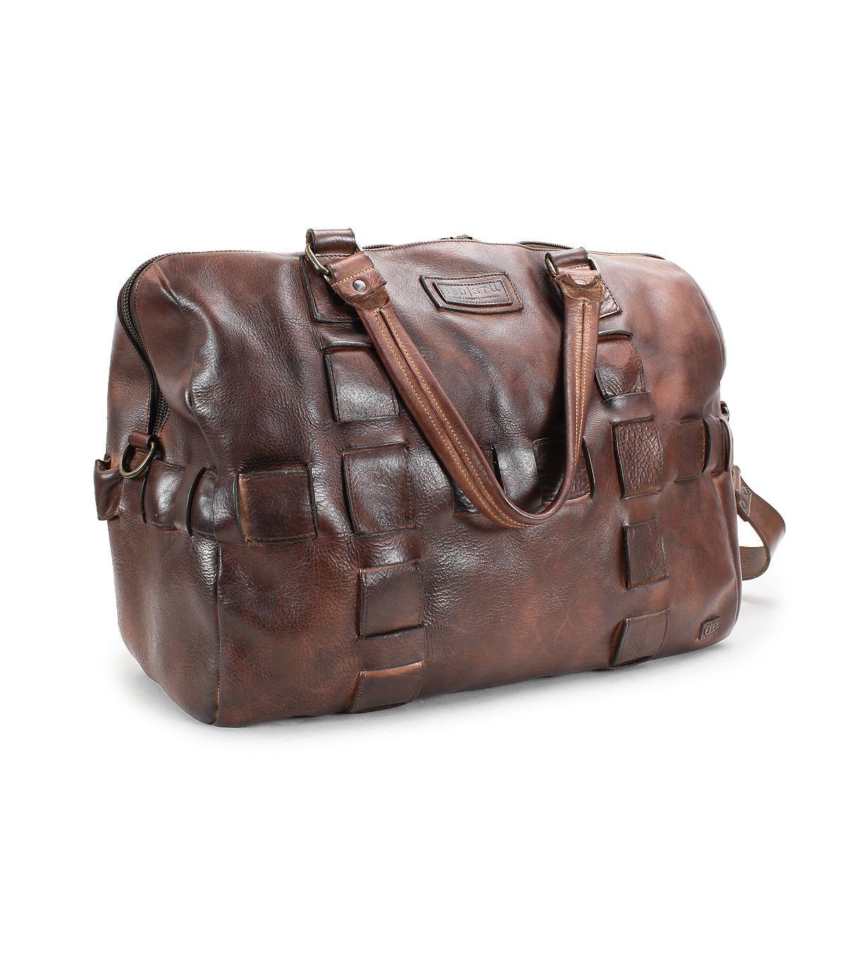 A handcrafted brown leather travel duffle bag with a textured pattern, sturdy handles, and an adjustable shoulder strap. The **Keg by Bed Stu** is impeccably designed to meet both style and functionality needs for any traveler.