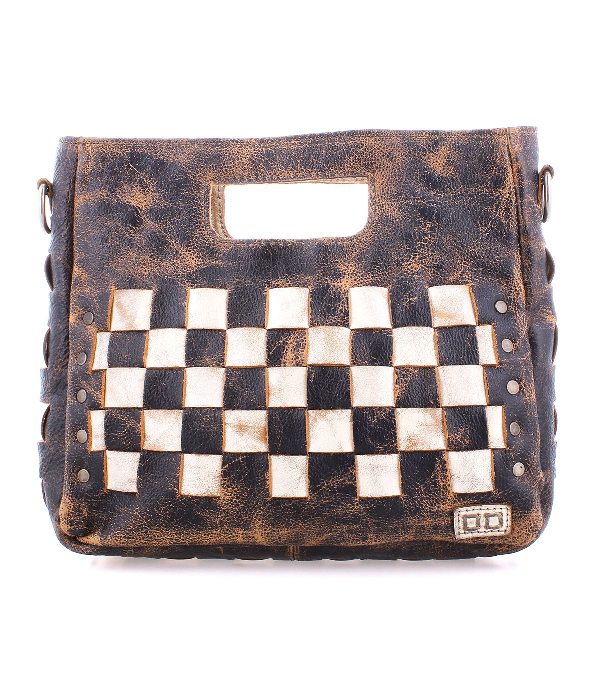 The Keiki bag by Bed Stu is a brown leather accessory featuring a built-in handle and a striking black and white checkerboard pattern on the front. It boasts a weathered, rustic look complemented by metallic rivet details. The adjustable strap allows for versatile crossbody wear, and the zip-top closure ensures added security.