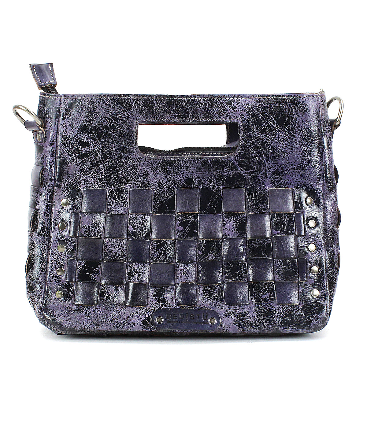 The Bed Stu Keiki is a black and purple textured leather crossbody bag featuring woven front panels, an adjustable strap, a cut-out handle, and metal studs along the lower sides.