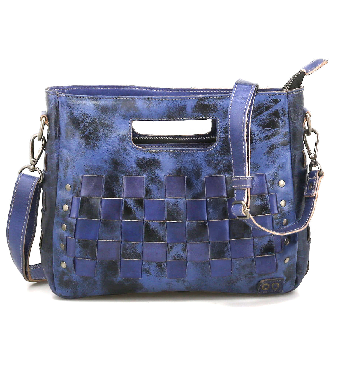 The Keiki crossbody bag by Bed|Stü features blue leather in a checkerboard pattern, adorned with metal rivets, a zip-top closure, an adjustable detachable shoulder strap, and a stylish cutout top handle.