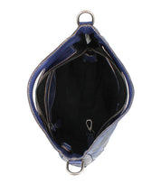 Top view of the Bed Stu Keiki blue crossbody bag featuring woven panels, a zippered pocket, black lining, and an interior clasp attachment.