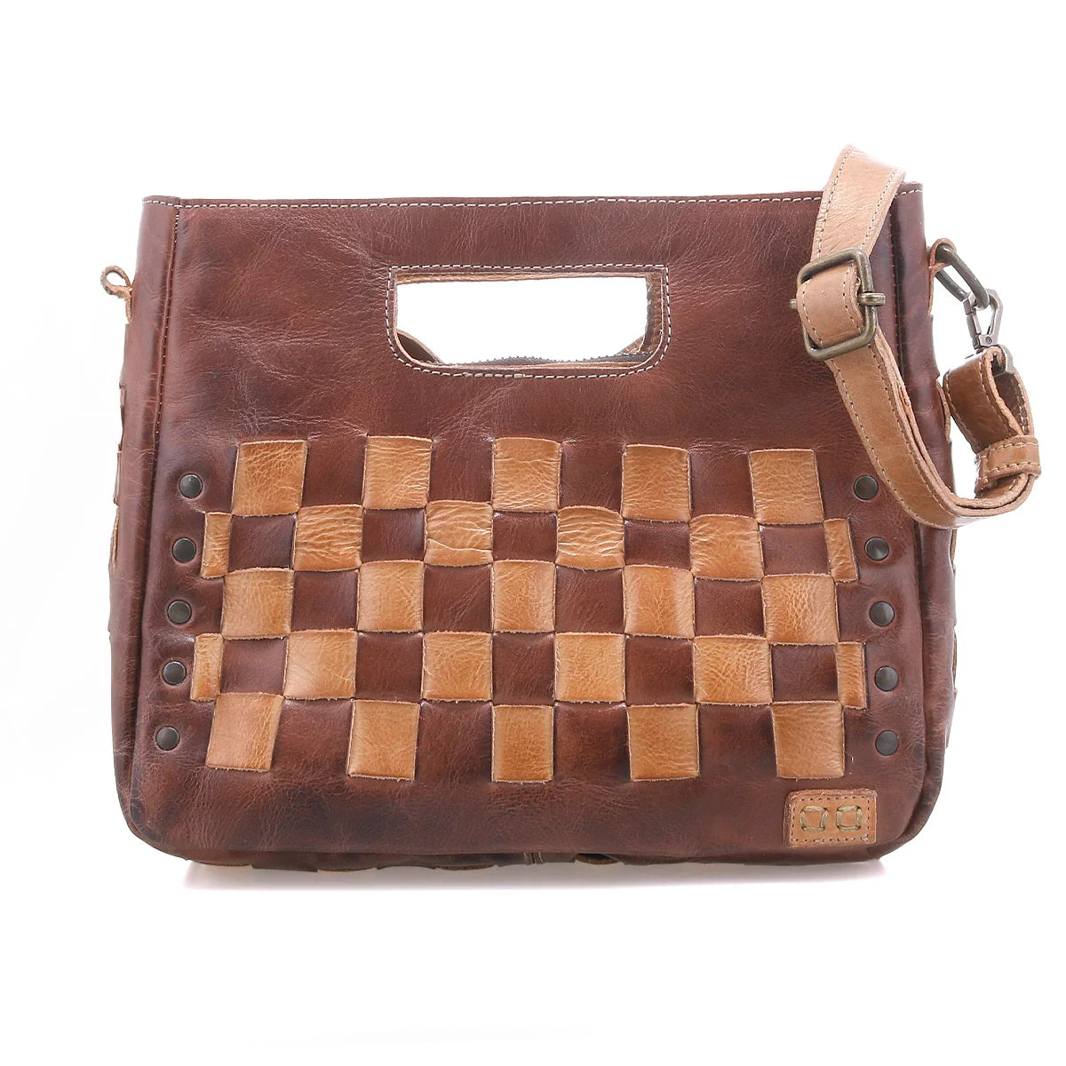 Introducing the Keiki by Bed|Stü—a compact brown leather crossbody bag featuring woven tan accents, a cutout handle, an adjustable shoulder strap, and metal rivet details on the front. This stylish accessory blends timeless design with modern versatility.