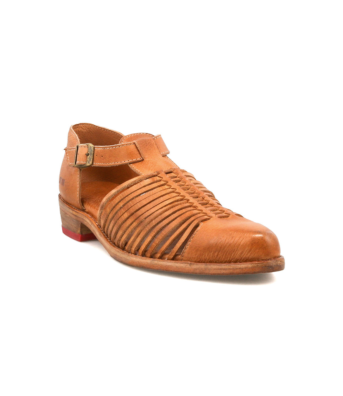 The Bed Stu Kenna is a brown leather sandal with a closed toe, woven cutouts, an adjustable ankle strap, low heel, and a small red accent on the back.