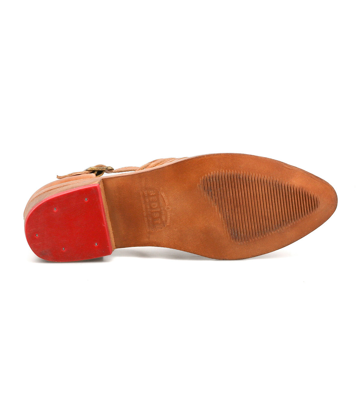 The image shows the underside of the Bed Stu Kenna, a brown leather closed-toe loafer featuring a pointed toe, red heel, and textured grip on the sole.
