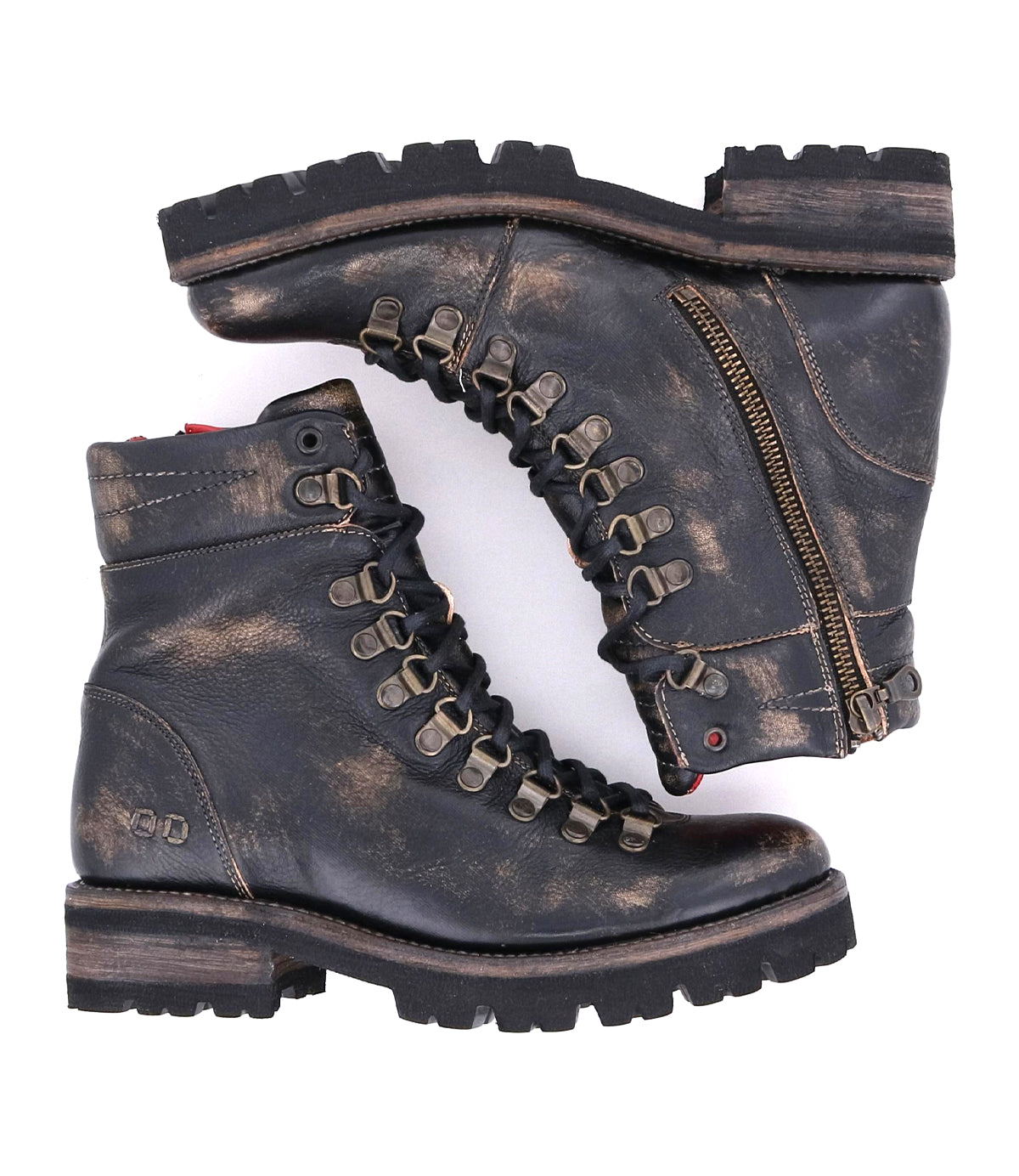 The Bed Stu Khya boots are distressed black leather lace-ups with side zippers, thick treaded outsoles, and metallic eyelets, shown side by side.