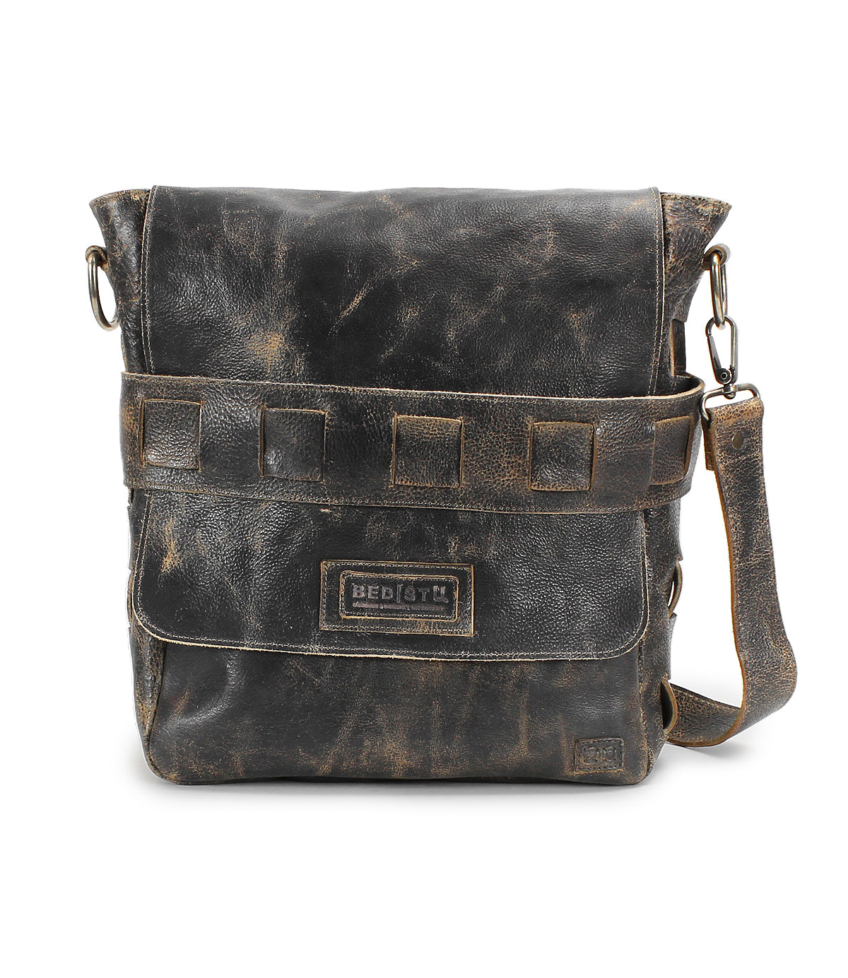 A distressed, handmade leather messenger bag with a front flap, horizontal strap detail, and adjustable shoulder strap. The bag boasts a worn, vintage appearance and an organic cotton-lined interior. Labeled &quot;Bed Stu&quot; on the front pocket, the Kure features vegetable tanned leather for durability.