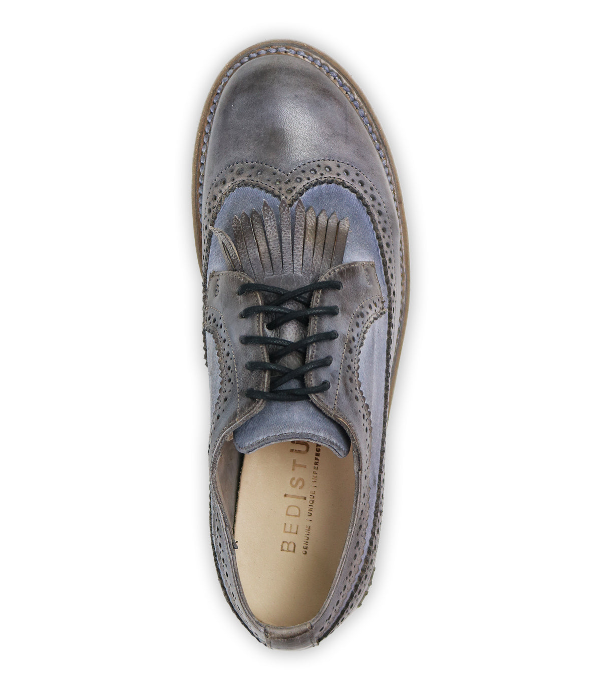 Top view of a gray leather brogue shoe with black laces, decorative perforations, and a subtle wingtip toe design, featuring the brand name "Bed Stu" on the insole. This product is known as Lita K - Archived.