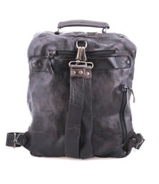 The Lafe backpack by Bed Stu is a spacious, worn black leather bag with multiple zippers and straps. It features a top handle, central metal hook for utility, and a security tab to keep your belongings safe on adventures.