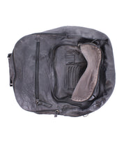 The "Lafe" by Bed Stu is a black leather backpack featuring multiple zippers, a front open pocket, and visible seams. Its spacious interior holds essentials securely with a safety tab. The handle and shoulder straps are partially visible for added style.