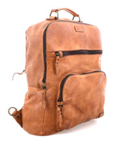 The Bed Stu Lafe is a brown leather backpack featuring two front zippered pockets and a top handle, displayed at an angle on a white background—perfect for stylish carry-on use.