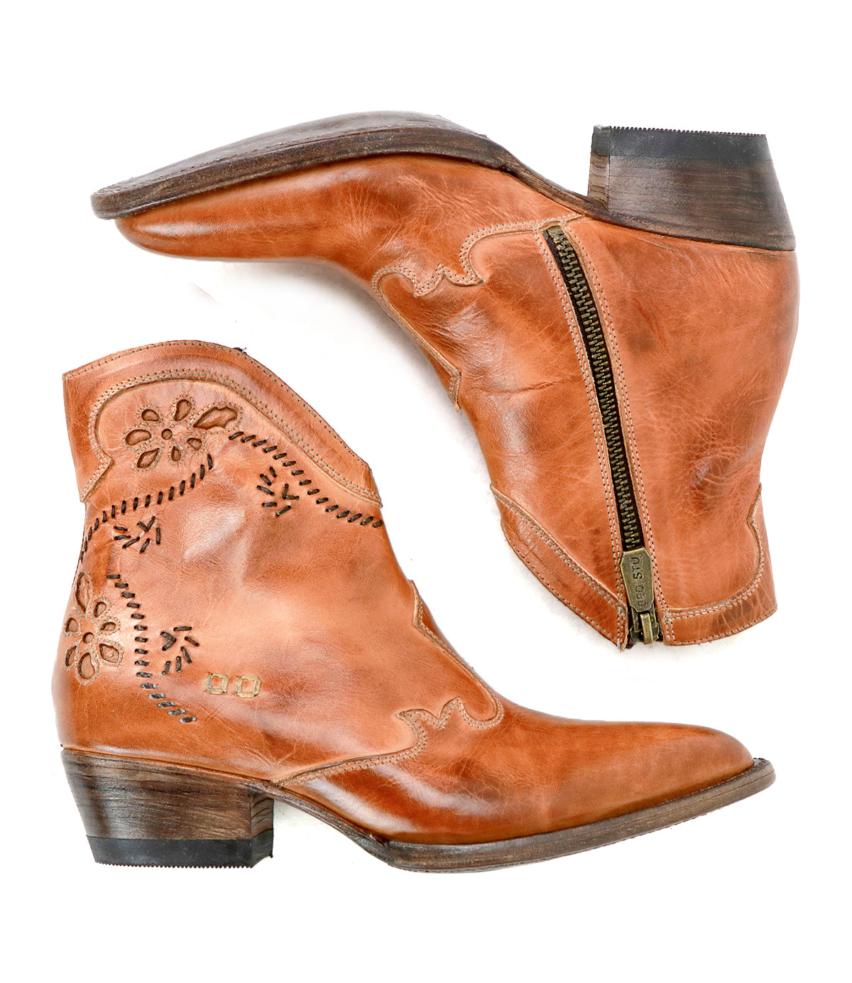 Pair of brown leather Laredoa ankle boots by Bed|Stü, inspired by feminine cowboy boots and featuring side zippers, decorative stitching, and low stacked heels, displayed on a white background.