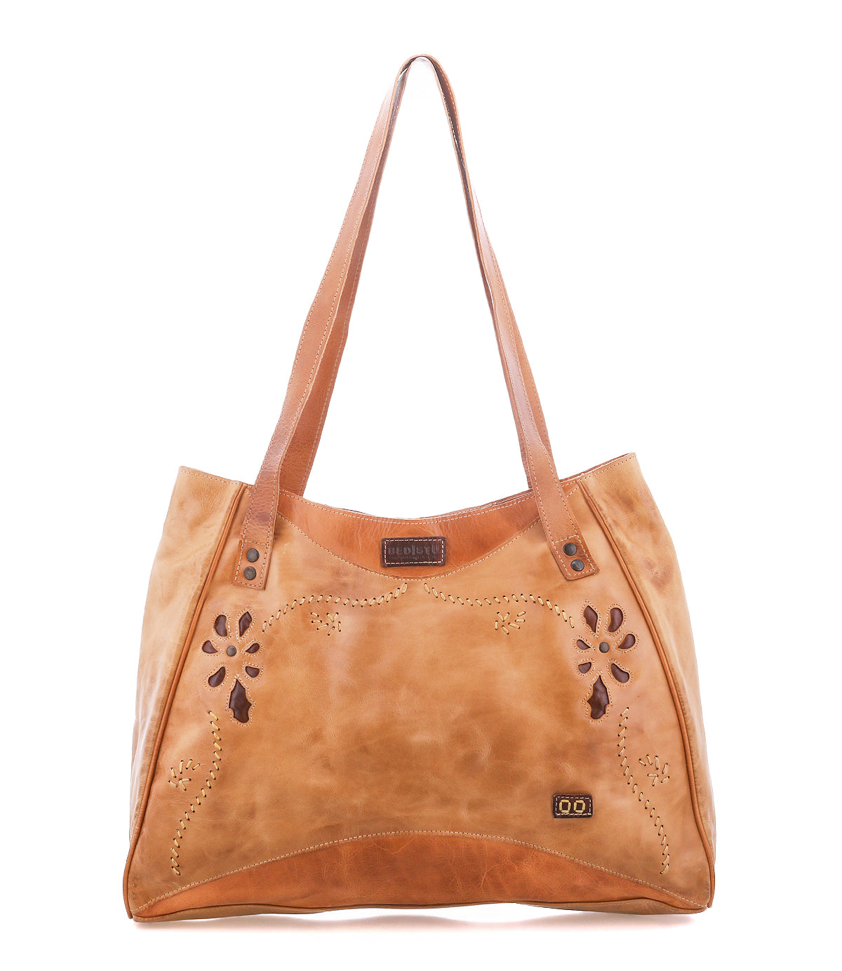 Larue LTC by Bed|Stü: light brown bag with floral cut-out designs, double handles, and a small metal logo plate in the lower right corner.