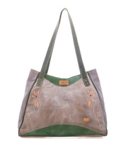 Bed|Stü Larue LTC: Gray and green leather shoulder bag with floral cutouts, double handles, and tan stitching accents on a white background.