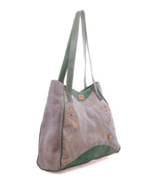 The Larue LTC by Bed|Stü is a gray and green leather shoulder bag featuring long handles, decorative stitching, and front cutout floral motifs.