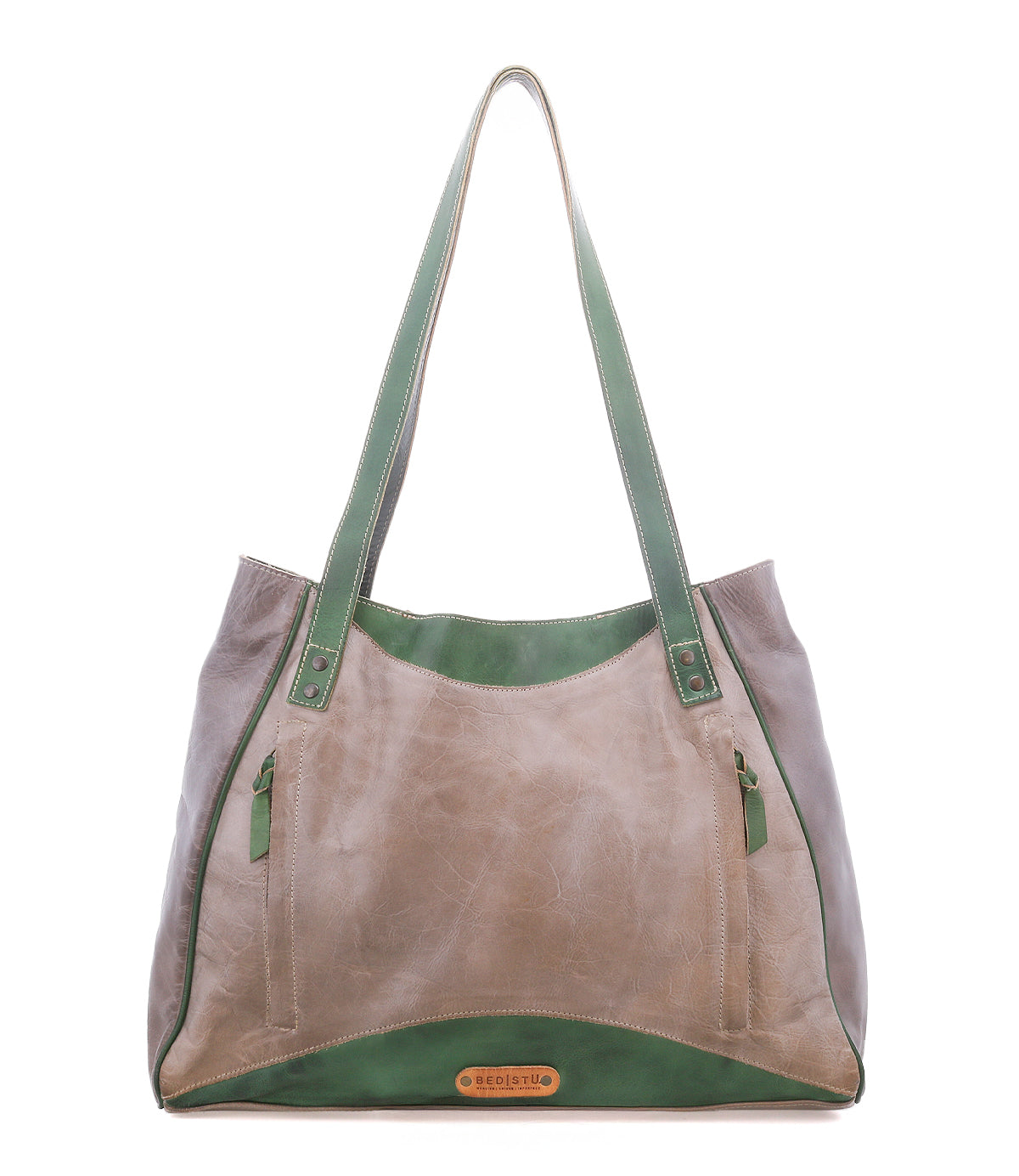 The Larue LTC by Bed|Stü is a large taupe leather shoulder bag with green accents, floral details, dual straps, zip pockets, and a logo patch at the bottom center.