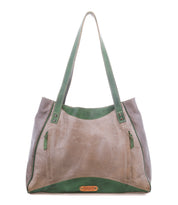 The Larue LTC by Bed|Stü is a large taupe leather shoulder bag with green accents, floral details, dual straps, zip pockets, and a logo patch at the bottom center.