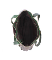 Top view of the Bed|Stü Larue LTC: handstitched bag with green handles and trim, featuring a roomy, dark-lined interior and visible stitching.