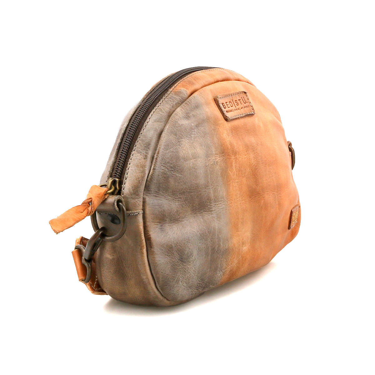 The Bed Stu Lavish is a compact, half-moon leather pouch in two-tone brown and tan, featuring a zipper and visible brand label—ideal for everyday use.