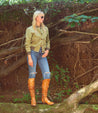 A woman wearing Leilani tan leather over the knee boots by Bed Stu.