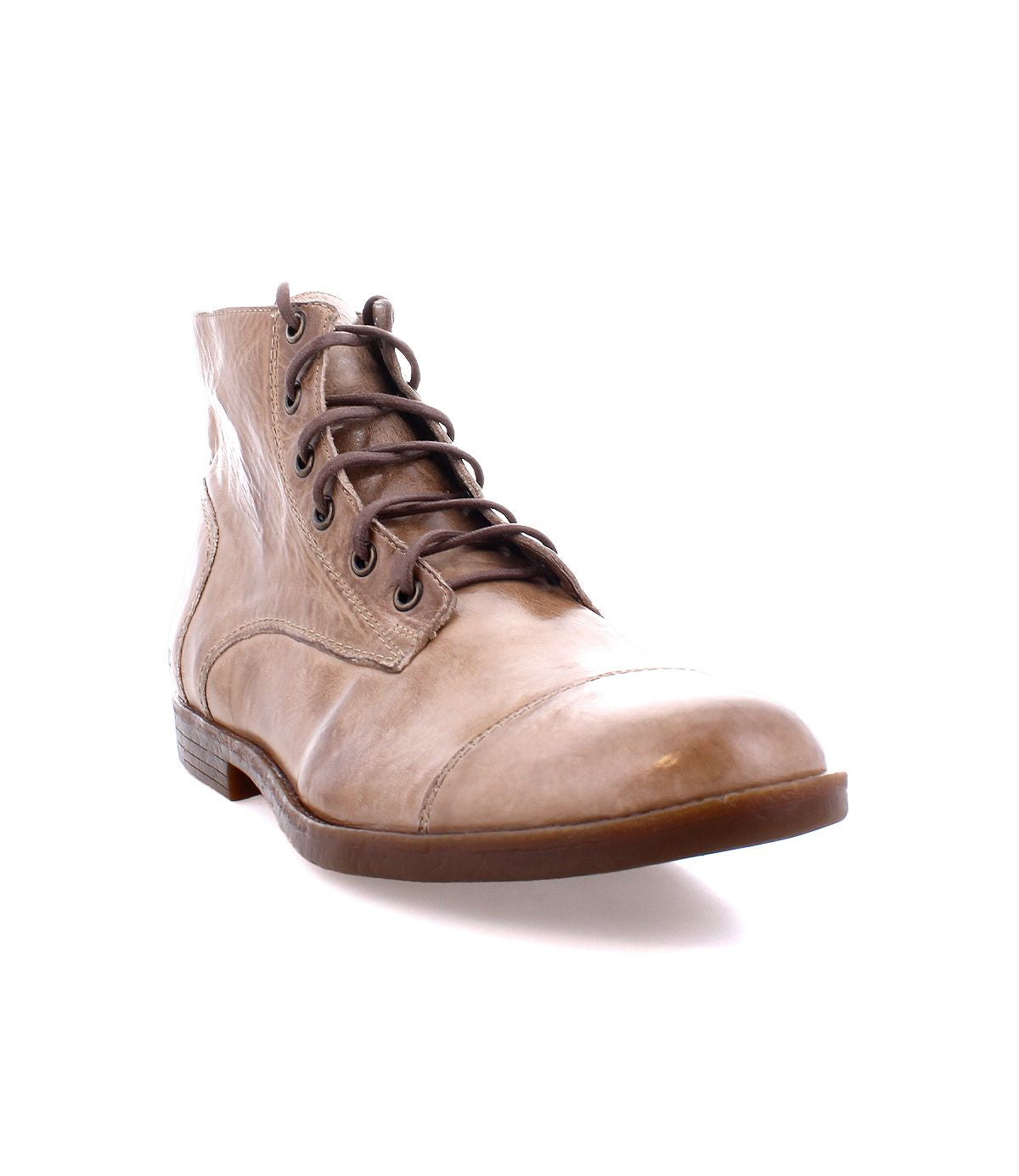 The Leonardo boot by Bed Stu, showcased from the front-left view against a white backdrop, is a brown leather design featuring laces, a flexible rubber outsole for durability, and a comfortable insole for all-day wear.