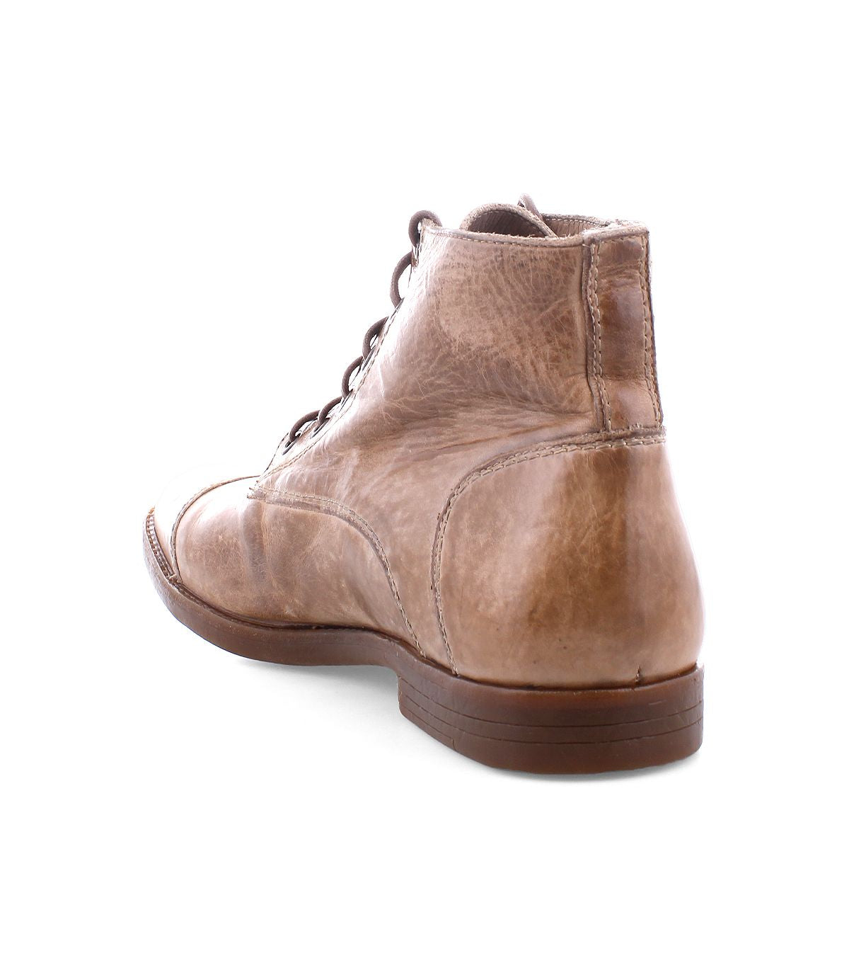 The Leonardo boot by Bed Stu is a tan leather design with visible laces and stitching, presented from the back angle, and includes a flexible rubber outsole for enhanced durability.