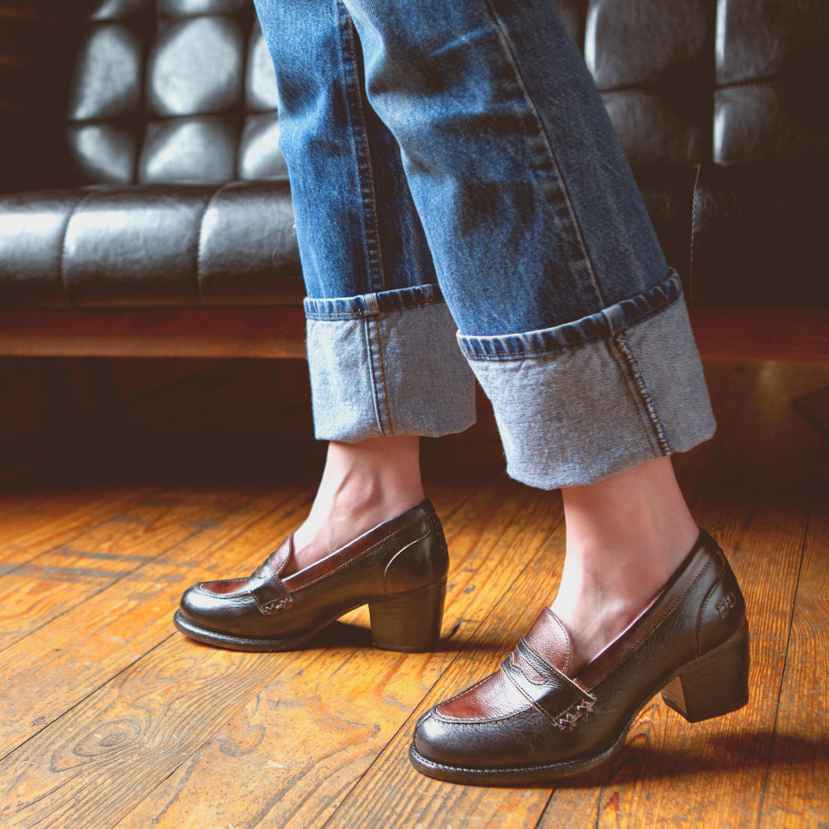 A woman wearing jeans and a pair of Liberty shoes from Bed Stu.