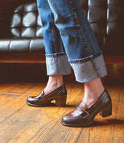 A woman wearing jeans and a pair of Liberty shoes from Bed Stu.