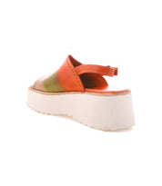 The Bed Stu Library is a retro platform sandal with an orange and green upper, open toe, and thick white sole, seen from the back—ideal for adding a '90s vibe to your look.