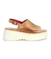 The Bed Stu Library is a brown leather platform sandal with open toe, slingback strap, adjustable buckle, and a thick white ridged sole for retro ’90s style.