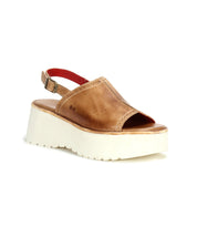 The Bed Stu Library sandal features brown leather, an open toe, slingback strap, and thick white sole for a '90s-inspired retro look.