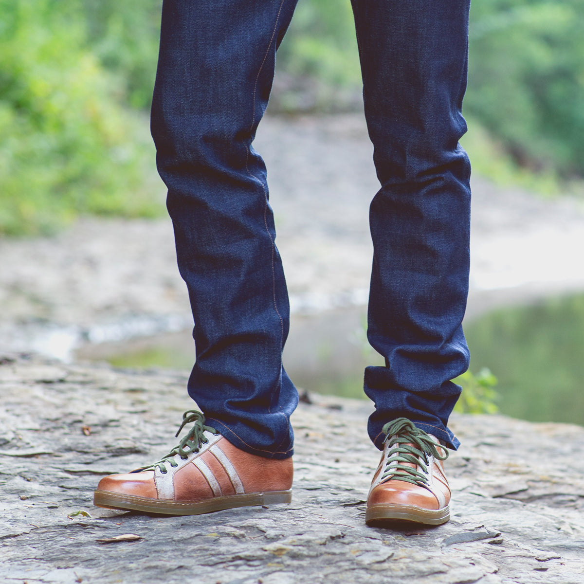 A man wearing a pair of Bed Stu Lighthouse sneakers.