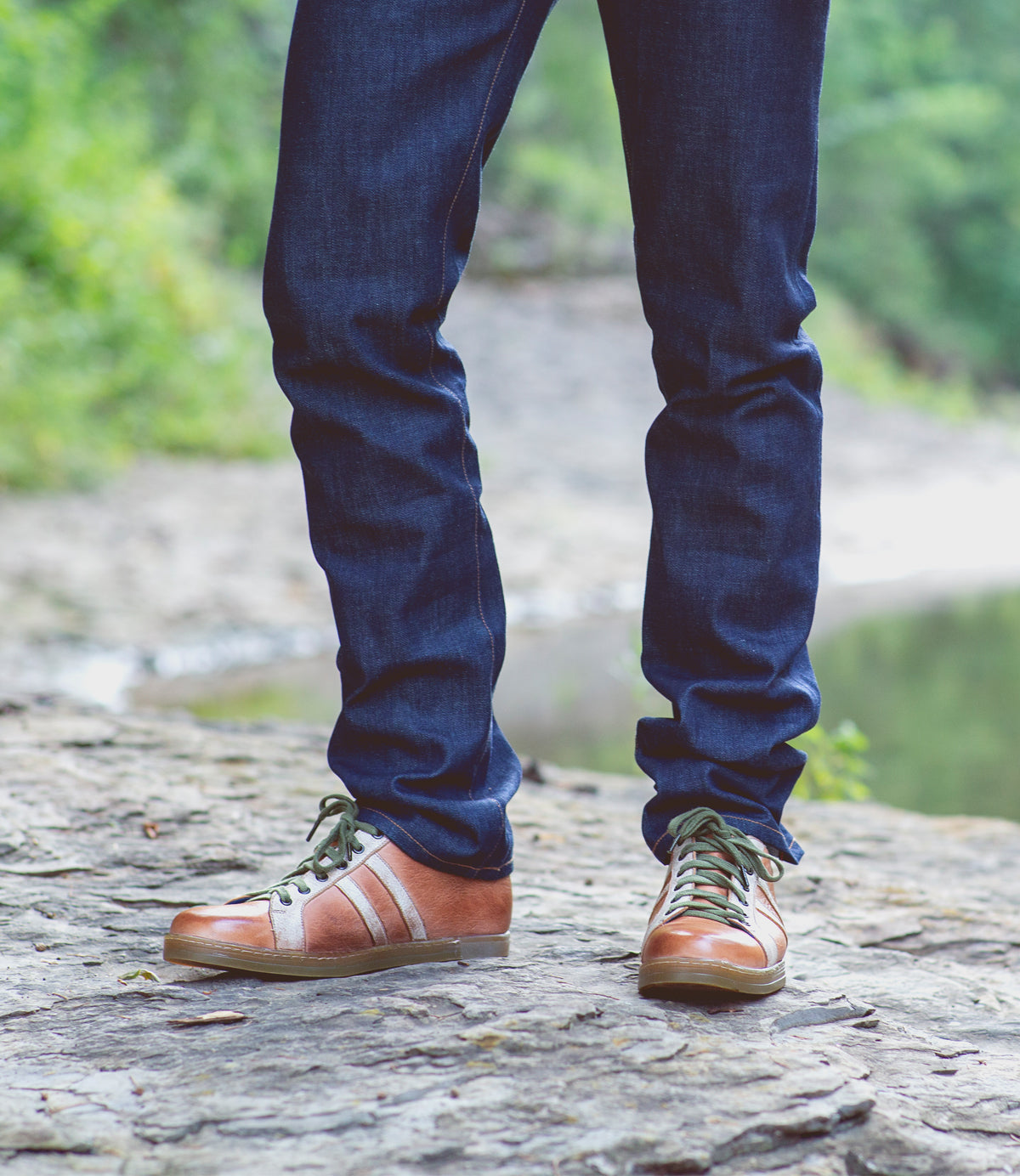 A man wearing a pair of Bed Stu Lighthouse sneakers.